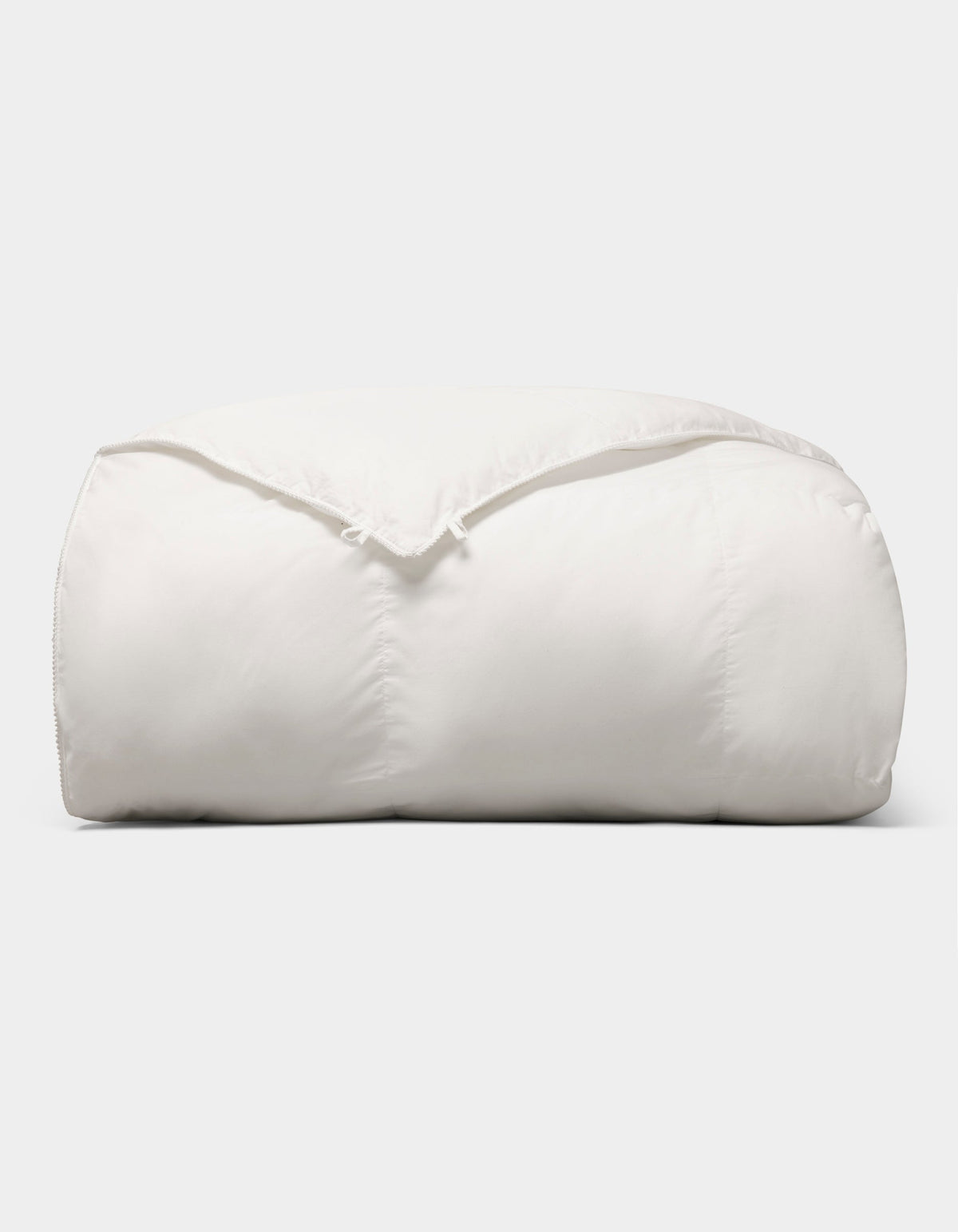 The Cozy Earth Down Alternative Comforter is neatly folded and fluffy, displayed against a plain light gray background. |Filling:Standard