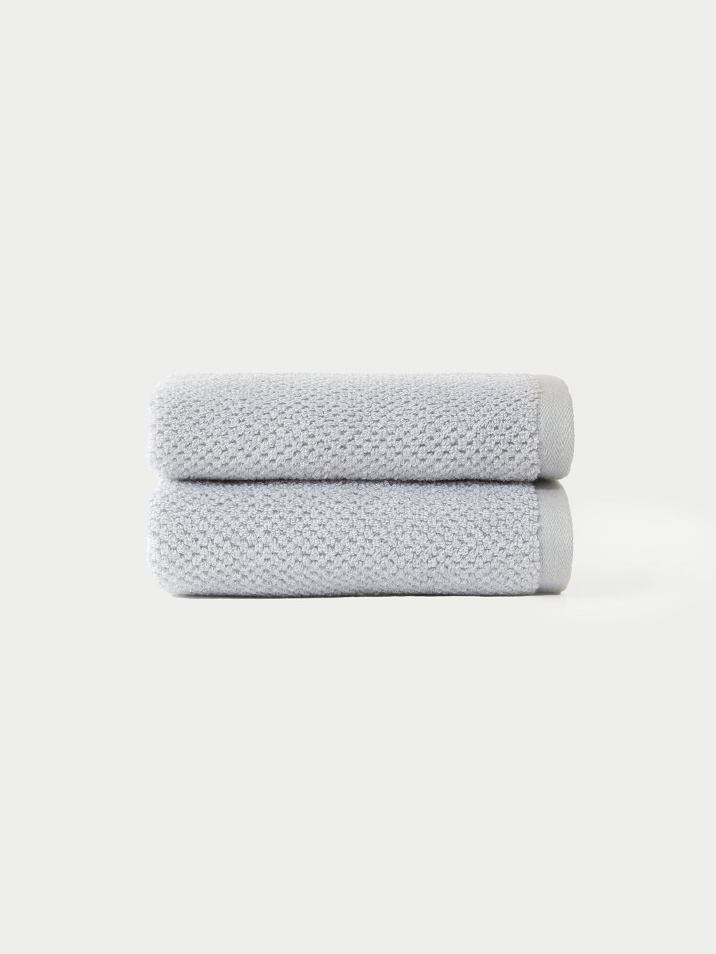 Nantucket Hand Towels in the color Heathered Harbor Mist. The Hand Towels are neatly folded. The photo of the Hand Towels was taken with a white background.|Color:Heathered Harbor Mist