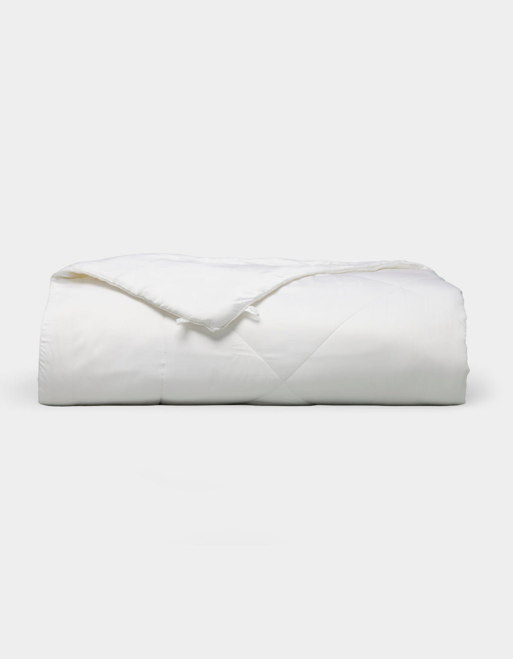 Bamboo viscose comforter meant to be paired with Charcoal, White, Driftwood, Oat, Light Grey, Walnut, Pacific Blue, Creme, Shore, Dove Grey, Peony, Lemonade, Laurel, Lavender, Classic Stripe in Pacific, Classic Stripe in Ebony, Classic Stripe in Laurel, River, Classic Stripe in Dew, Lavender, Sonoma Floral in Vintage White, or Mulberry sheets