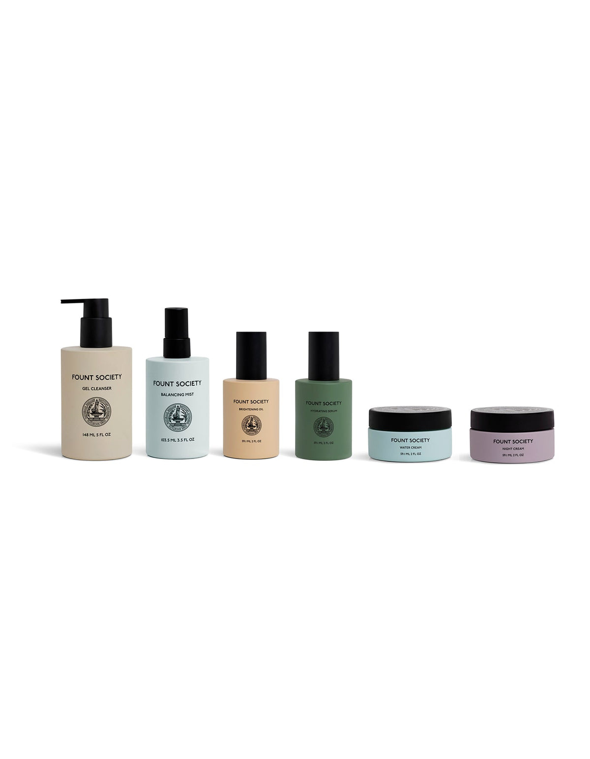 Six Cozy Earth Day-to-Night Essentials skincare products in pastel-colored bottles and jars, featuring pumps, sprays, and screw-top containers, arranged in a row against a white background.