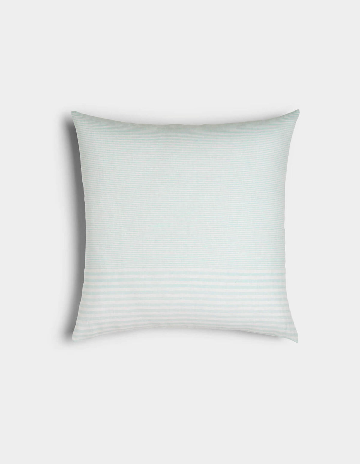 The Cozy Earth Striped Throw Pillow is a square white pillow featuring subtle horizontal light gray stripes, displayed against a plain light background.|Color:Mixed Stripe Tide and Sea Salt |Size:20" x 20"
