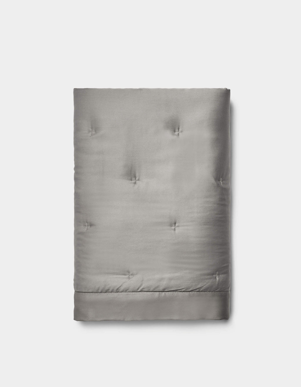 The Cozy Earth Bamboo Quilted Shams in light gray feature a smooth, slightly shiny surface with subtle tufted details, neatly folded and set against a plain white background.|Color:Charcoal