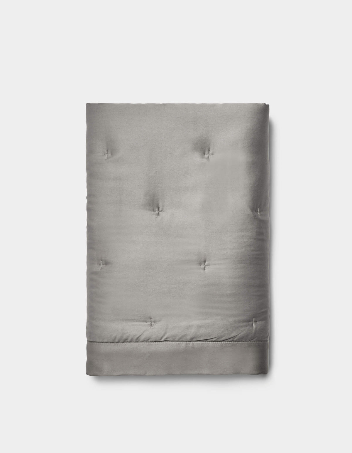The Cozy Earth Bamboo Quilted Shams in light gray feature a smooth, slightly shiny surface with subtle tufted details, neatly folded and set against a plain white background.|Color:Charcoal