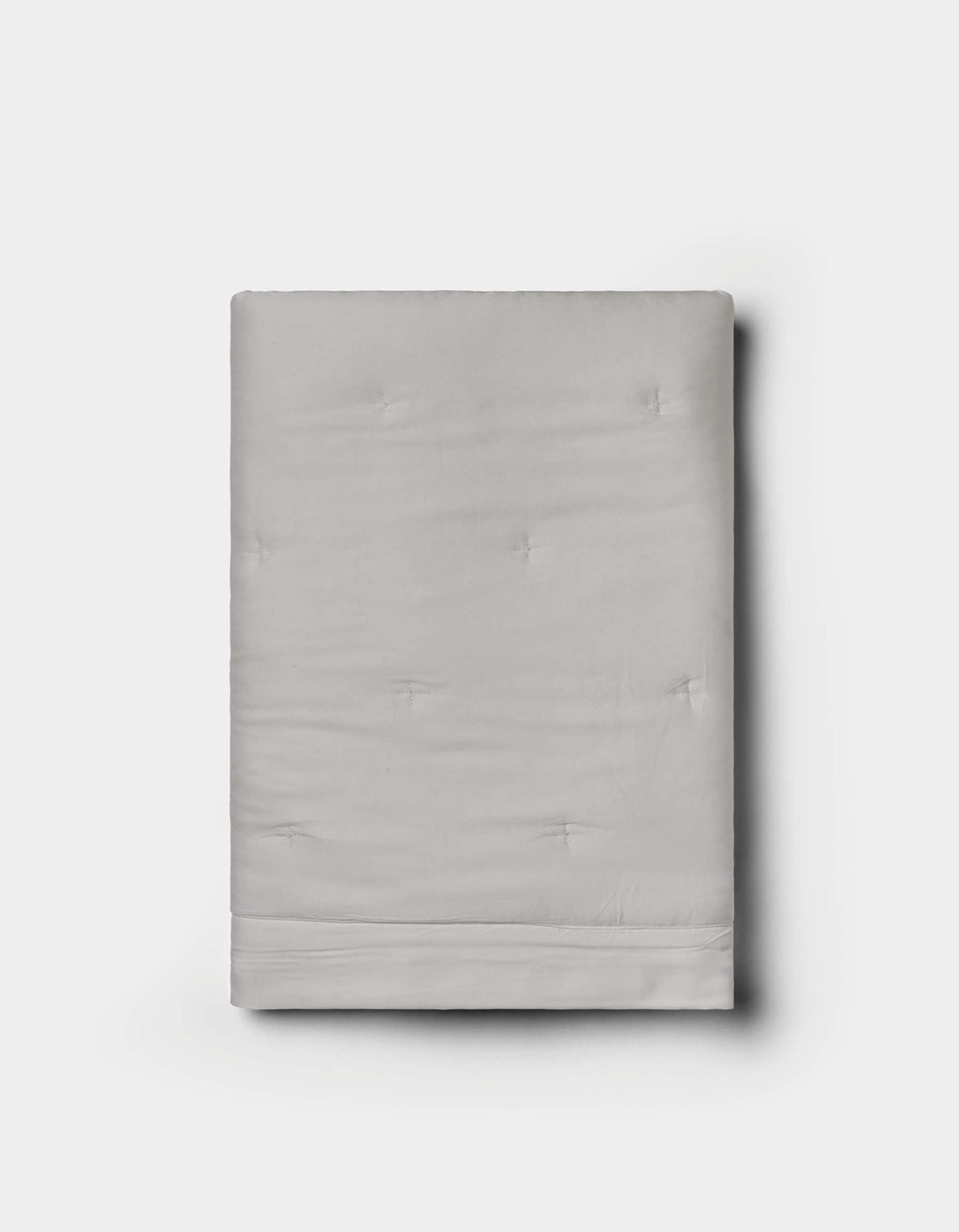 A neatly folded Cozy Earth Bamboo Quilted Sham in light gray with subtle tufted details, displayed against a plain white background.|Color:Light Grey