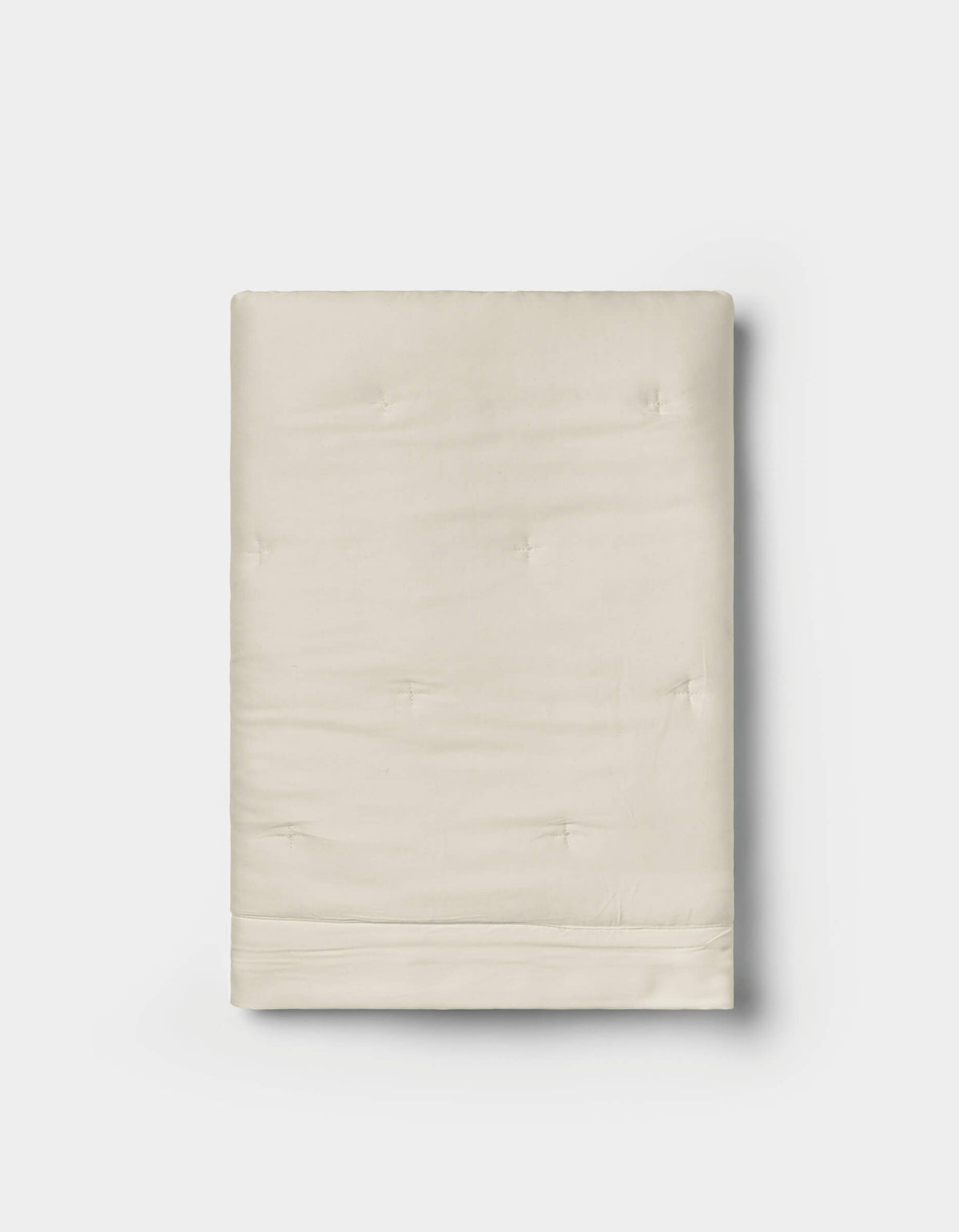 A pair of folded, cream-colored Bamboo Quilted Shams by Cozy Earth, featuring a smooth texture and subtle tufted details, displayed on a white background.|Color:Oat