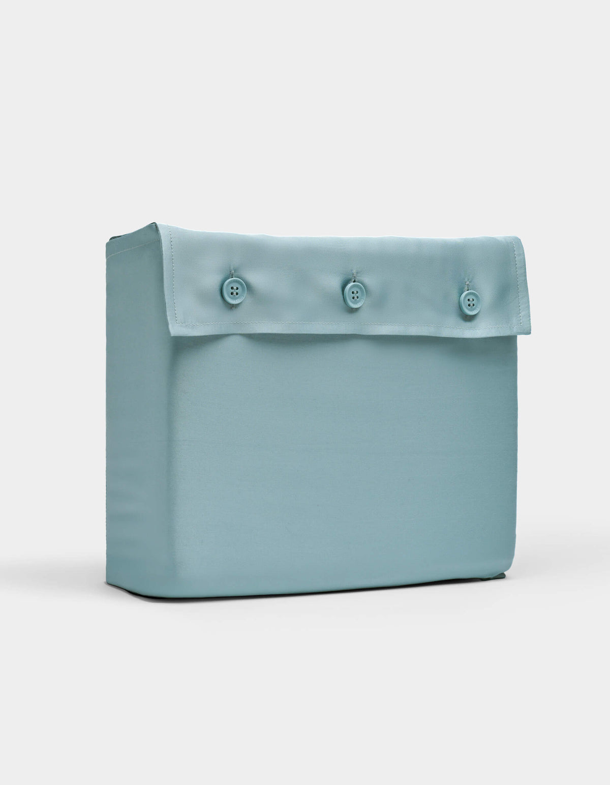A Cozy Earth Bamboo Sheet Set, neatly folded in a light blue rectangular fabric pouch with a flap secured by three matching buttons, displayed against a plain white background.|Color:River