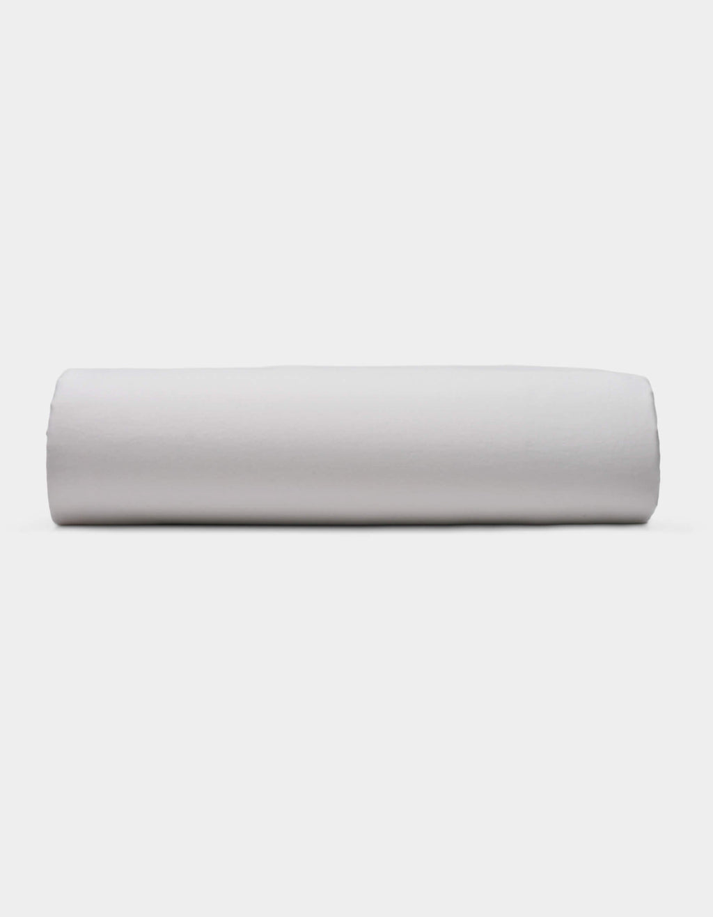 A Soft-Wash Cotton Fitted Sheet by Cozy Earth is displayed lying flat on a light surface with a neutral background.|Color:Dew