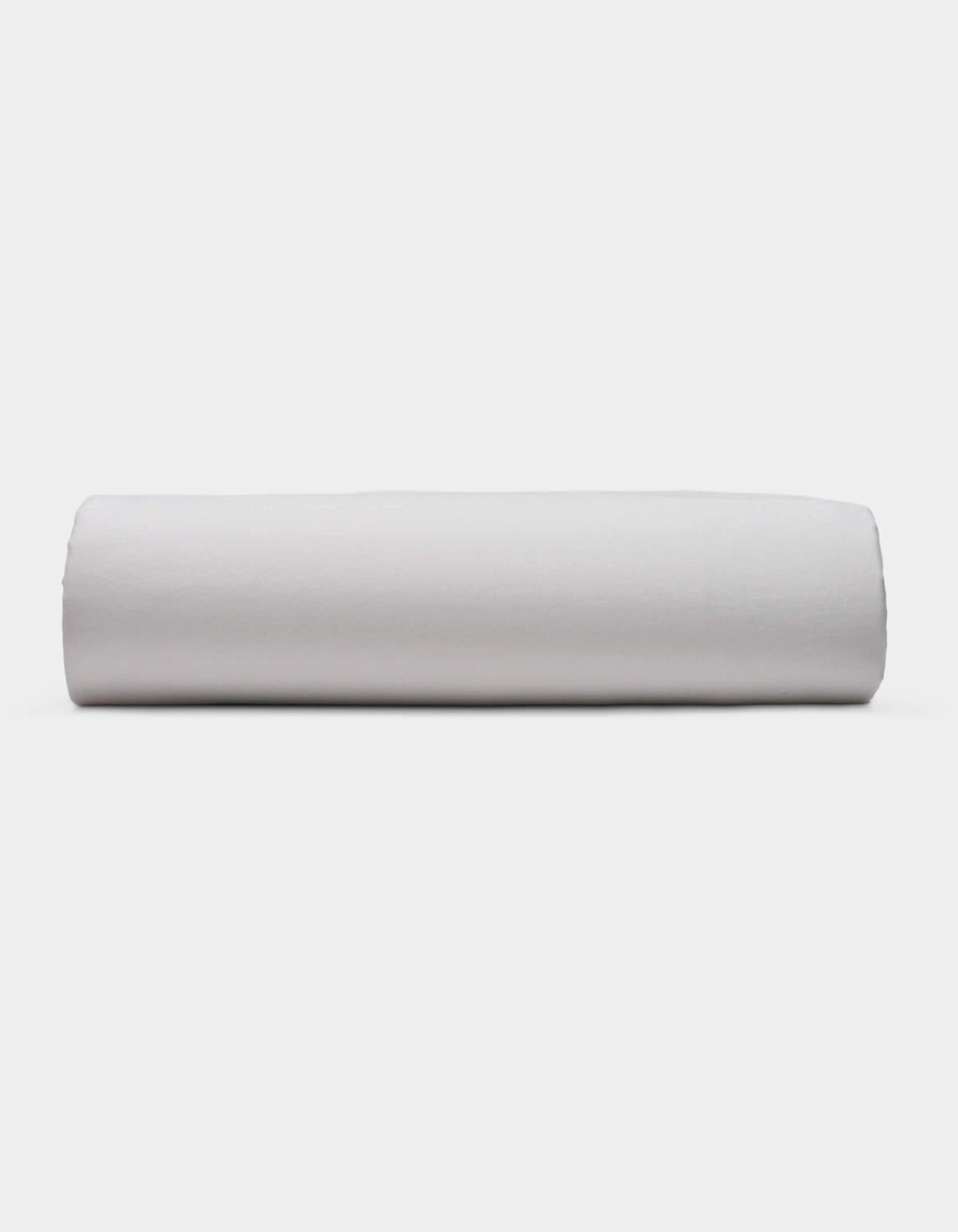 A Soft-Wash Cotton Fitted Sheet by Cozy Earth is displayed lying flat on a light surface with a neutral background.|Color:Dew
