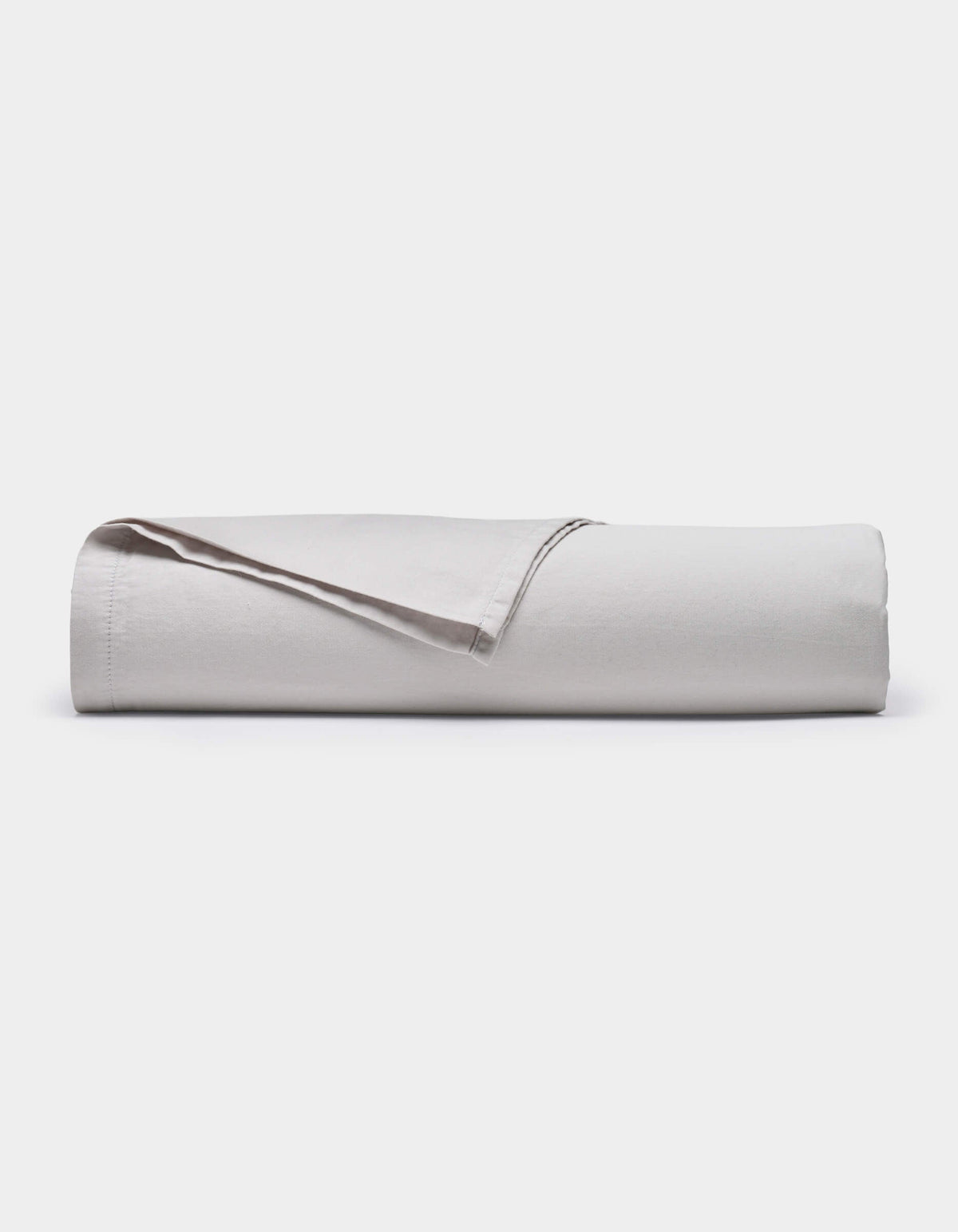 The Cozy Earth Soft-Wash Cotton Flat Sheet, shown neatly rolled with one edge lifted, is displayed against a plain white background.|Color:Dew