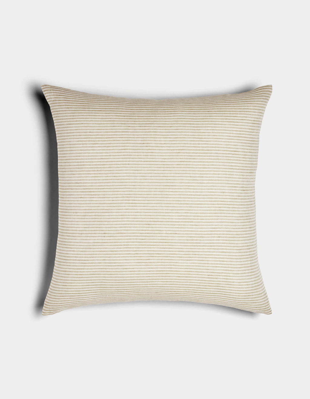 The Cozy Earth Striped Throw Pillow features light beige and white thin horizontal stripes on a rectangular design, displayed against a white background with a soft shadow cast to the left.|Color:Medium Stripe Sandalwood and Coconut |Size:24" x 24"