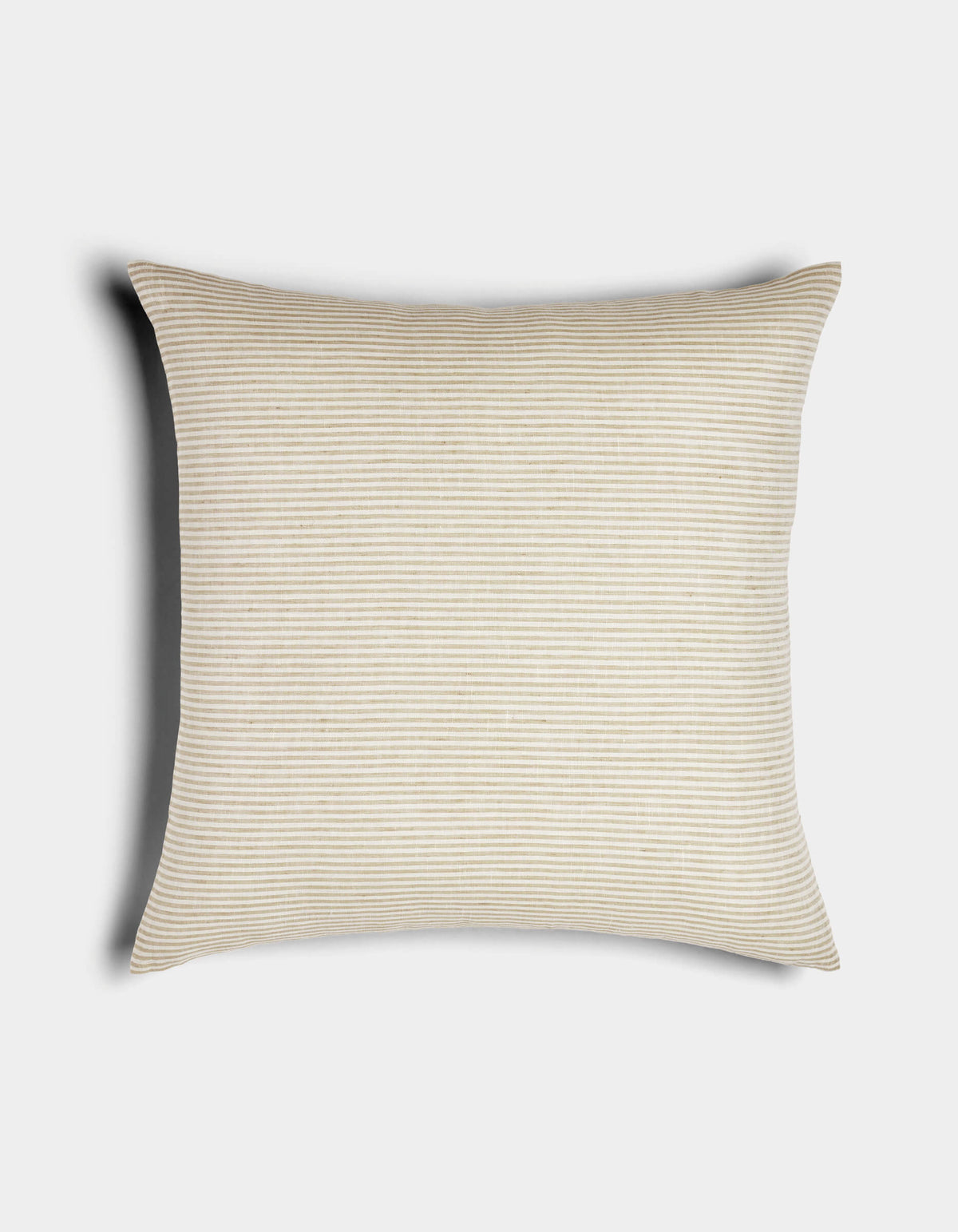 The Cozy Earth Striped Throw Pillow features light beige and white thin horizontal stripes on a rectangular design, displayed against a white background with a soft shadow cast to the left.|Color:Medium Stripe Sandalwood and Coconut |Size:24" x 24"