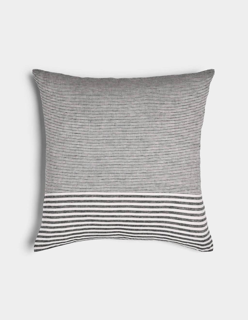 The Cozy Earth Striped Throw Pillow features thin black and white horizontal stripes with a wider striped band near the bottom, displayed on a plain white background.|Color:Mixed Stripe Eclipse and Sea Salt |Size:24" x 24"