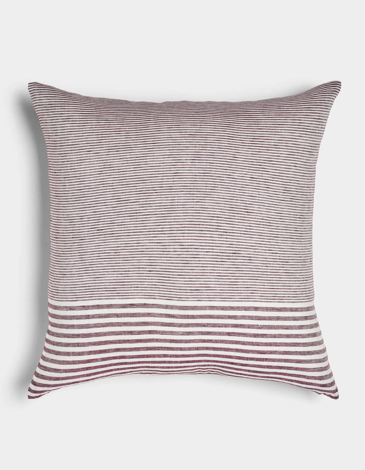 The Cozy Earth Striped Throw Pillow features thin burgundy and white horizontal stripes with a bold band of wider stripes at the bottom, displayed on a white background.|Color:Mixed Stripe Currant and Sea Salt |Size:26" x 26"