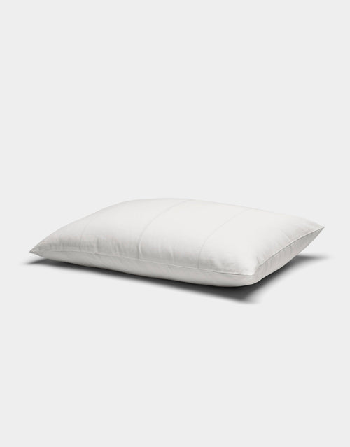 The Baja Double Sided Sham by Cozy Earth is a white, rectangular pillow with subtle horizontal stitching, displayed against a plain light gray background.|Color:Laurel Stripe/Striped Bone