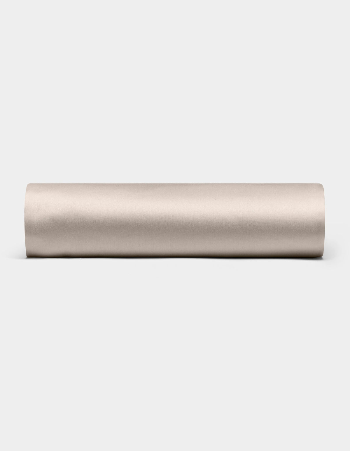A Cozy Earth Bamboo Fitted Sheet in plain, light beige is shown lying horizontally on a white background, viewed from the side.|Color:Driftwood