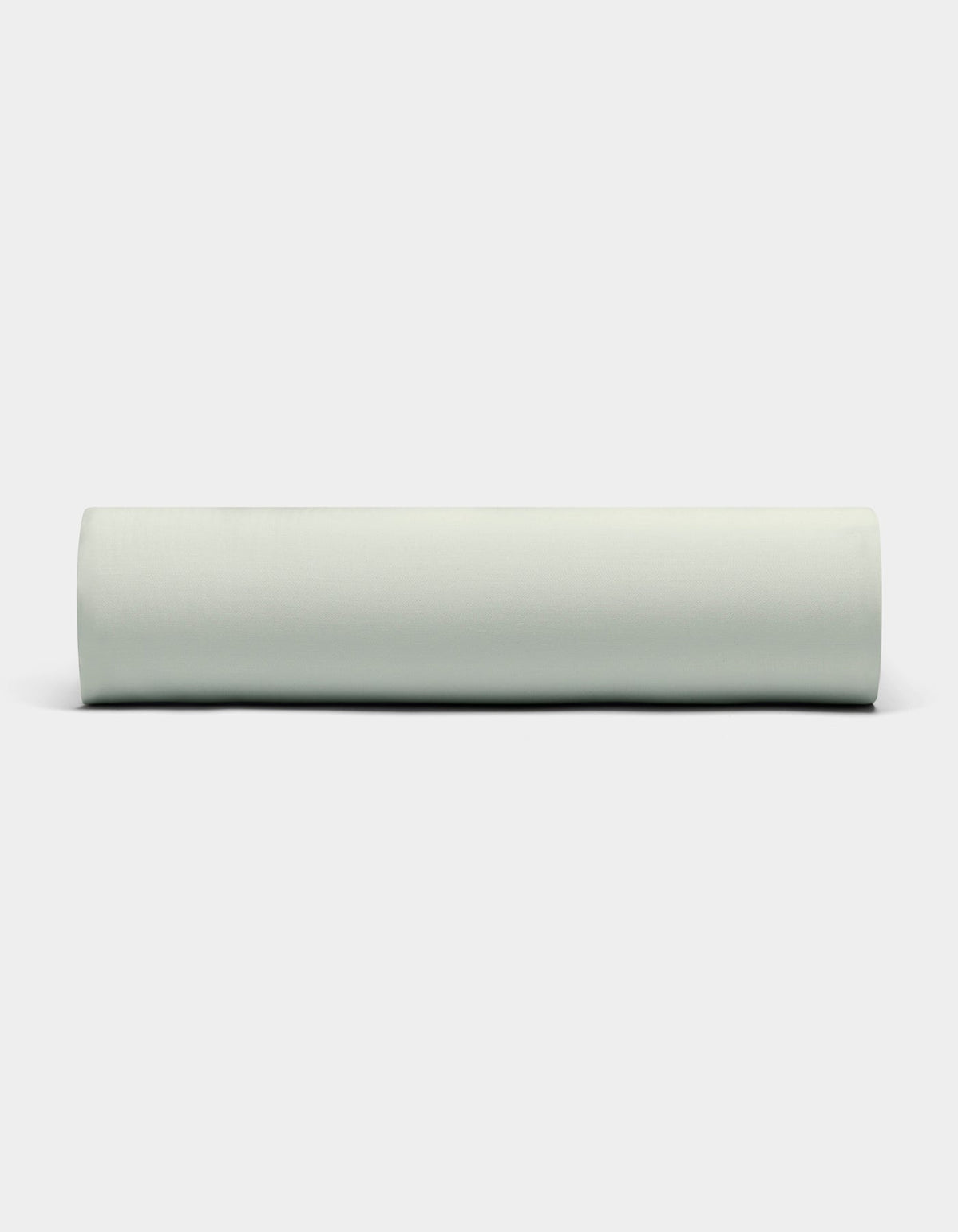 A Bamboo Fitted Sheet by Cozy Earth is displayed against a plain white background, viewed from the side. |Color:Laurel