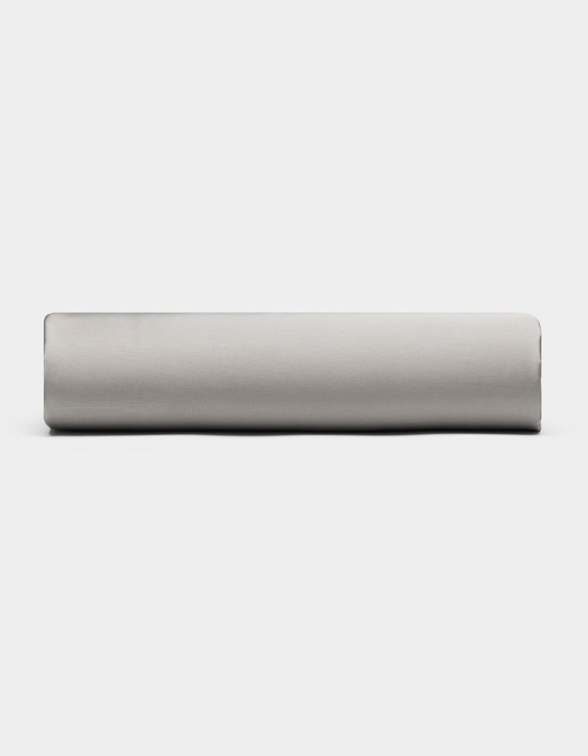 A Bamboo Fitted Sheet by Cozy Earth in light gray is displayed from the side against a plain white background.|Color:Light Grey