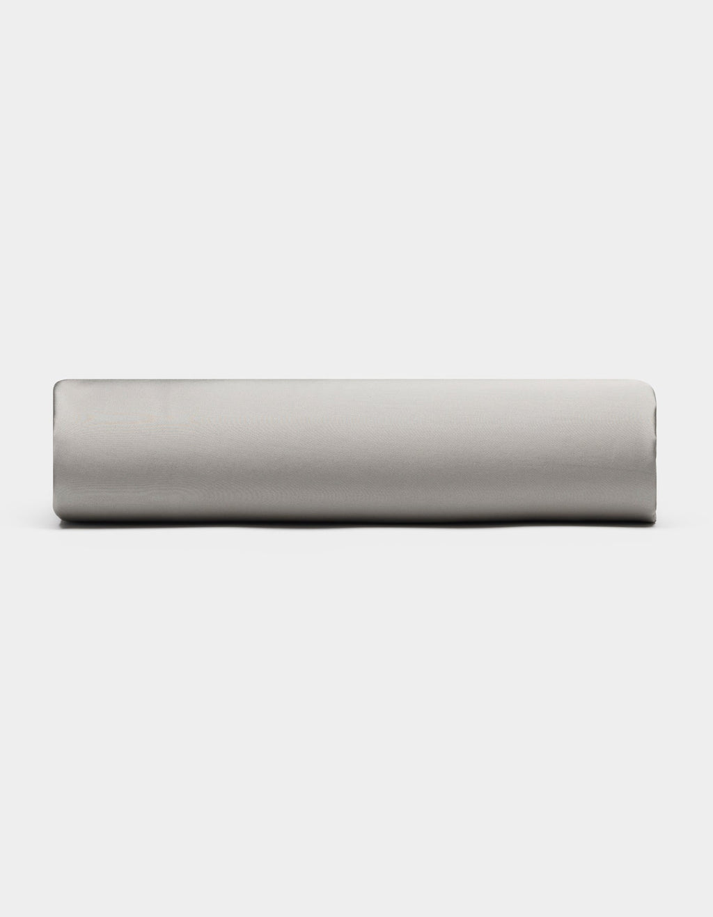 A Bamboo Fitted Sheet by Cozy Earth in light gray is displayed from the side against a plain white background.|Color:Light Grey