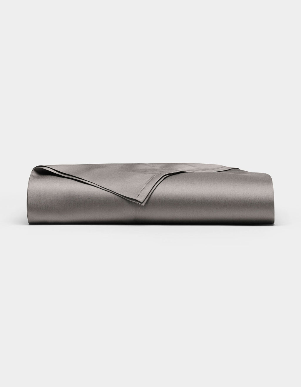 A neatly folded, smooth Cozy Earth Bamboo Flat Sheet in grey is displayed against a plain white background.|Color:Charcoal