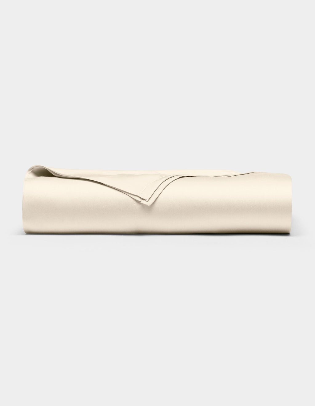 The Cozy Earth Bamboo Flat Sheet, in a light beige color, is neatly folded and displayed against a plain, light gray background.|Color:Creme