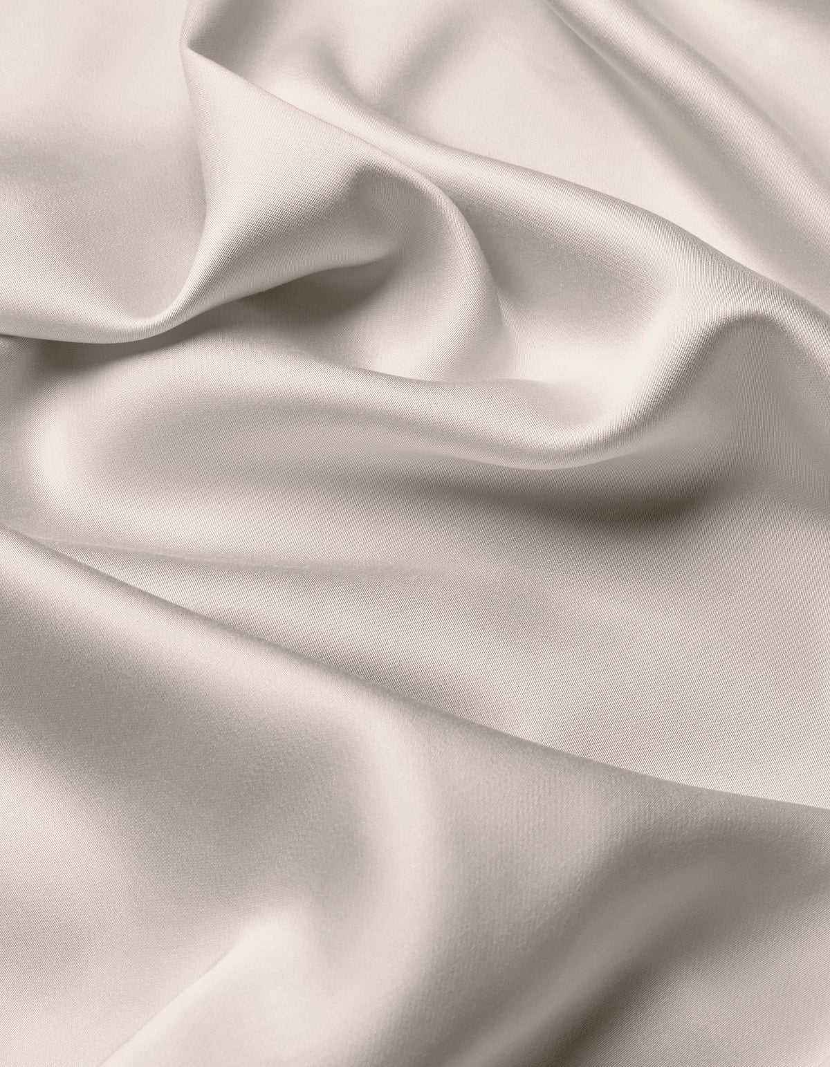 The Cozy Earth Bamboo Flat Sheet features a smooth, light-colored fabric with soft folds and gentle draping, creating a silky, elegant texture.|Color:Driftwood