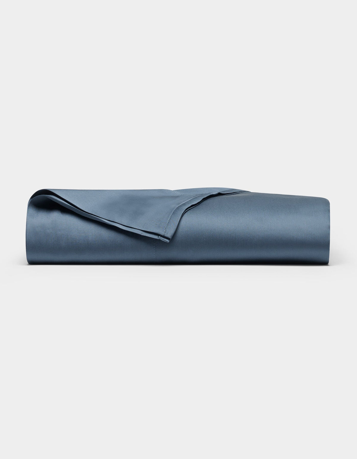 A neatly folded Cozy Earth Bamboo Flat Sheet is displayed against a plain white background.|Color:Pacific Blue