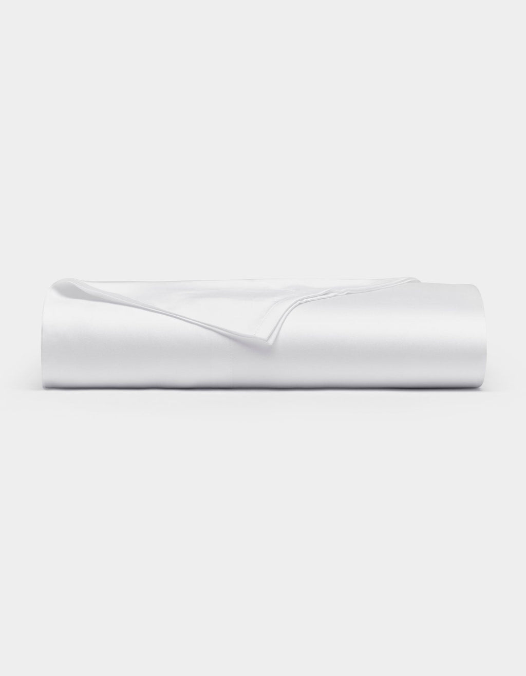 A neatly folded Cozy Earth Bamboo Flat Sheet in white rests on a flat surface against a plain white background.|Color:White