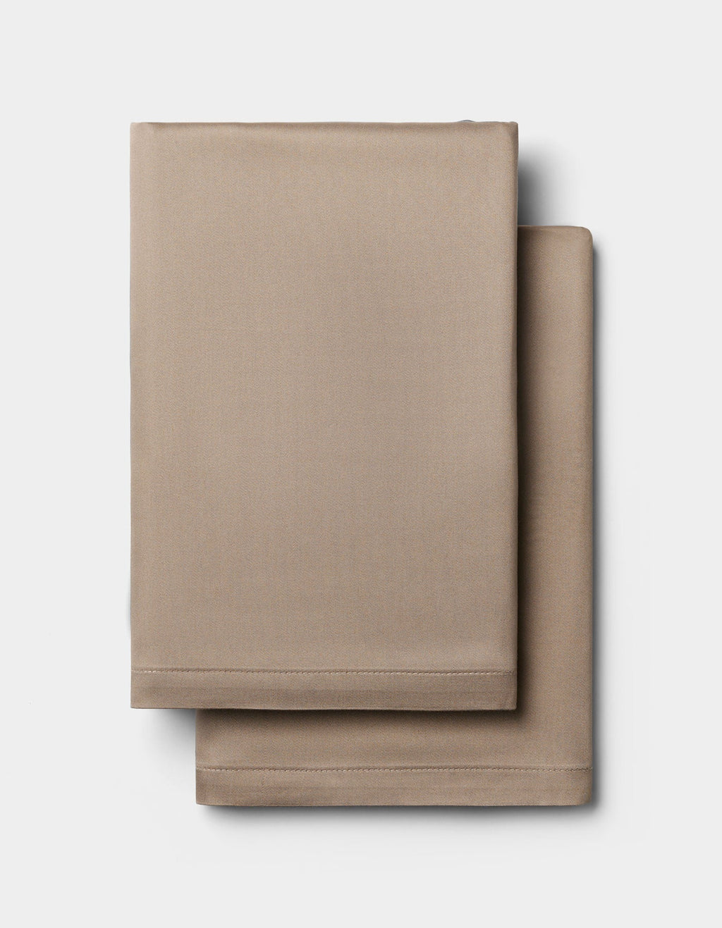 Two neatly folded Cozy Earth Bamboo Pillowcases are stacked on a plain white background.|Color:Walnut