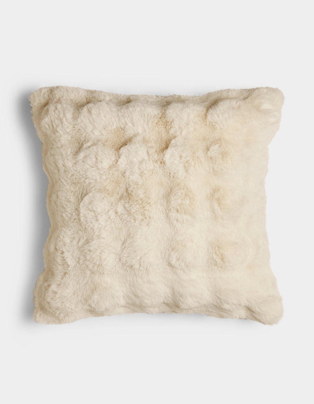 The Bubble Cuddle Pillow by Cozy Earth is a square, cream-colored pillow with a soft, fur-like texture, displayed against a plain white background.|Color:Creme |Size:Euro