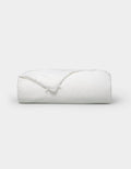 The Cozy Earth Silk Comforter is neatly folded with a corner turned down, showcased against a plain white background.|Filling:Standard