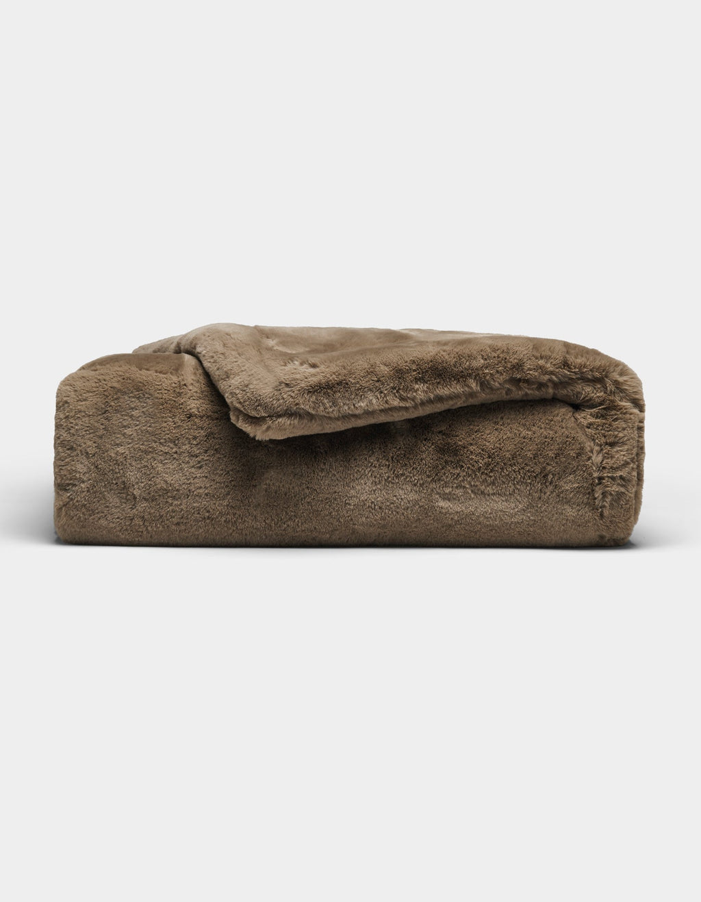 The Cozy Earth Cuddle Blanket, featuring a plush brown fabric and soft, fuzzy texture, is shown folded against a plain white background.|Color:Walnut