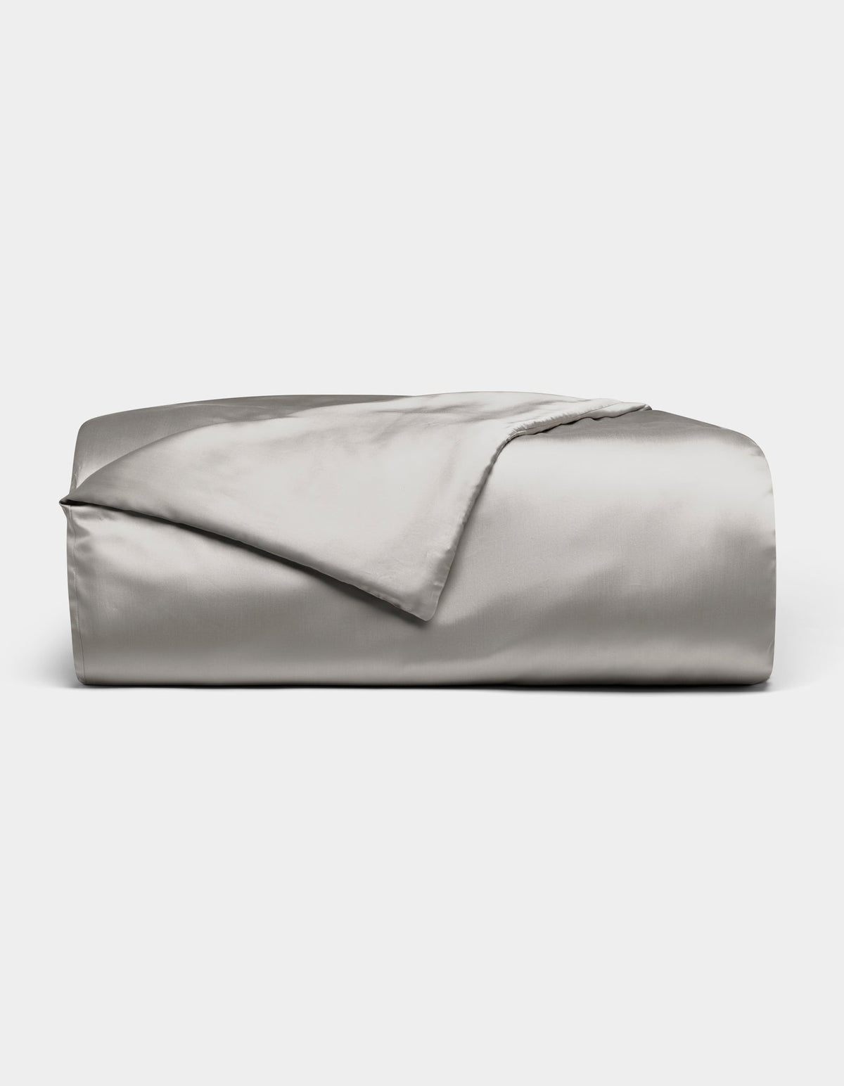 A neatly folded Cozy Earth Bamboo Duvet Cover in light gray is displayed against a white background, with one corner turned back to reveal its smooth, shiny fabric.|Color:Light Grey