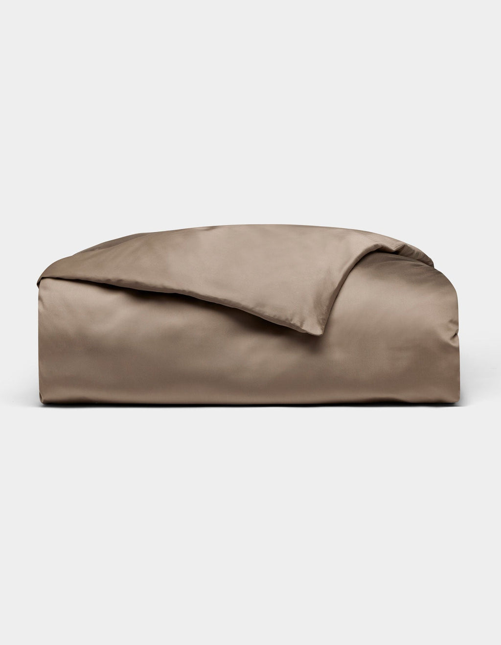 The Cozy Earth Bamboo Duvet Cover in taupe is neatly folded with one corner flipped over, displayed against a plain light grey background.|Color:Walnut