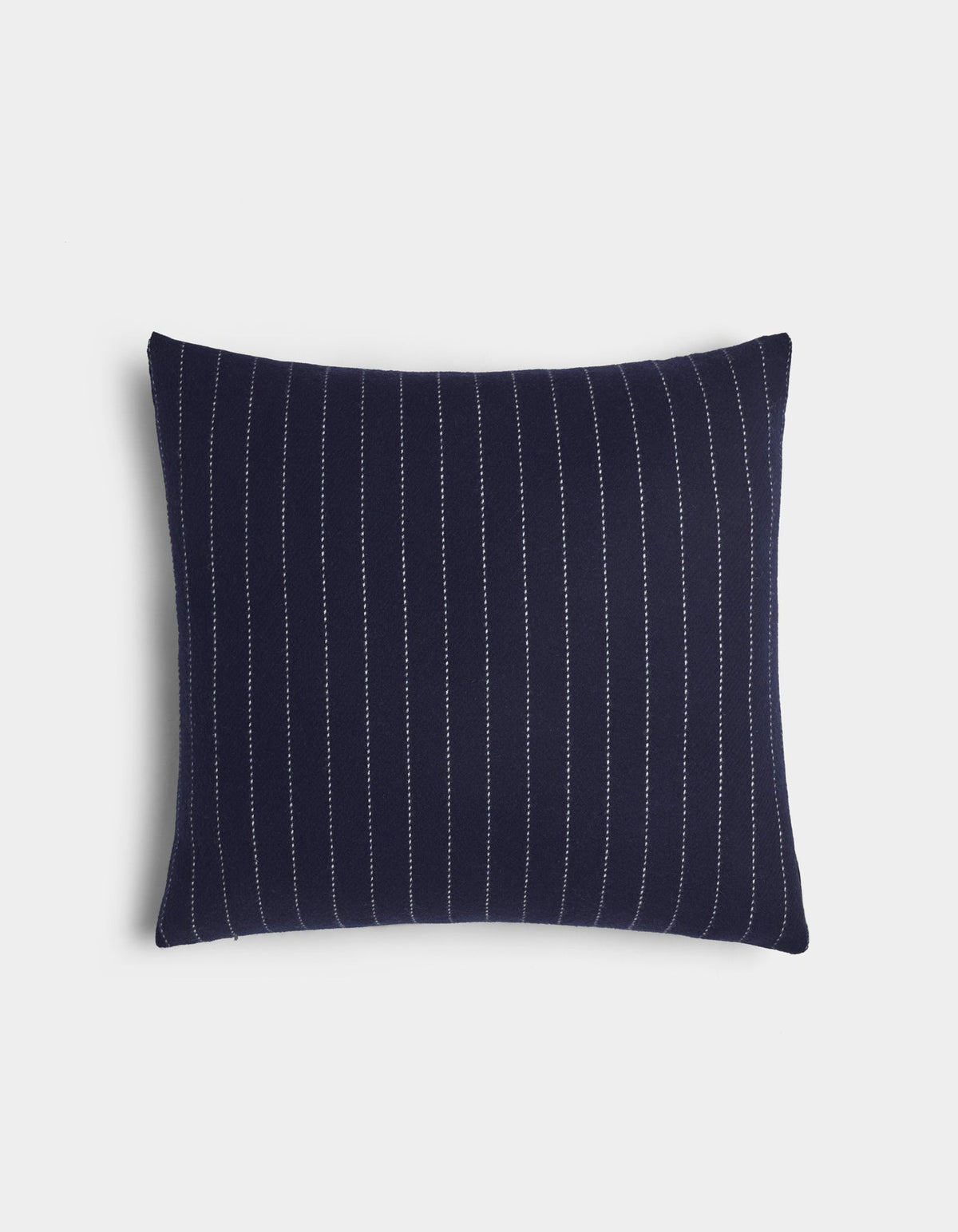 The Florence Pillow by Cozy Earth is a rectangular navy blue pillow with vertical white pinstripes, shown on a plain white background.|Color:Navy