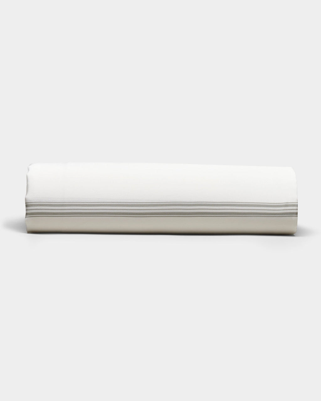 The Bamboo Sheet Set by Cozy Earth is shown neatly rolled, featuring subtle horizontal gray stripes near the edge, set against a plain light gray background.|Color:Baja Stripe in Laurel