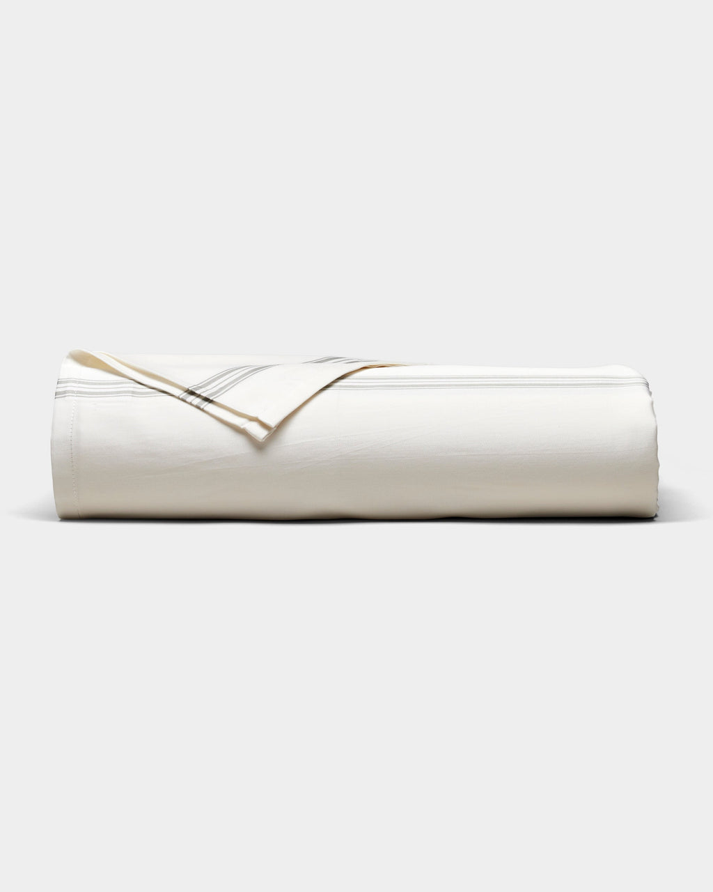 The Cozy Earth Bamboo Sheet Set, in cream with subtle gray stripes, is neatly rolled and displayed on a plain white background.|Color:Baja Stripe in Laurel