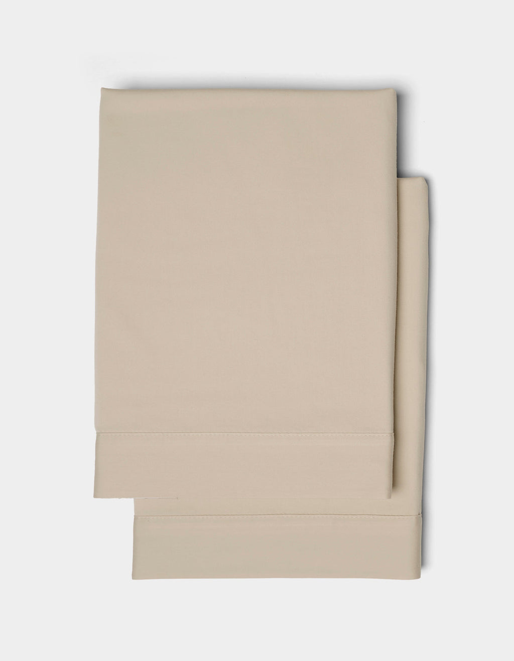 Two neatly folded Cozy Earth Soft-Wash Cotton Shams with stitched hems, displayed on a plain white background.|Color:Driftwood