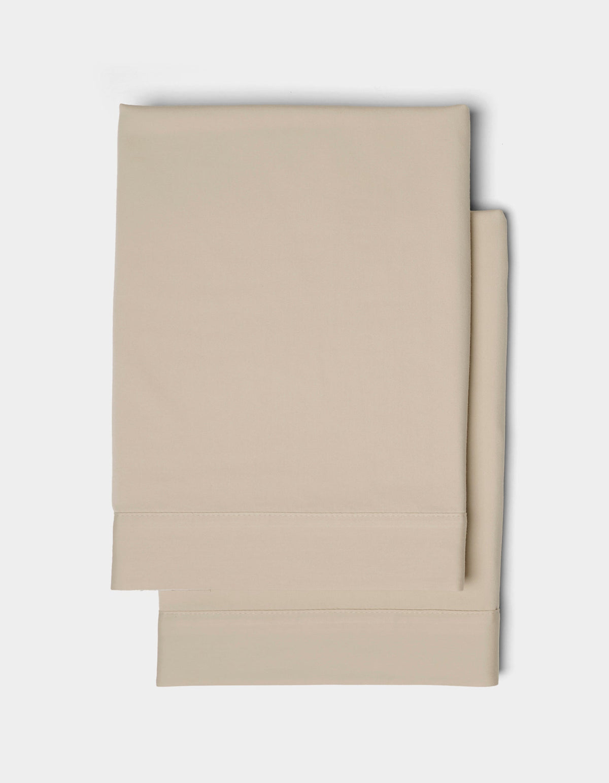 Two neatly folded Cozy Earth Soft-Wash Cotton Shams with stitched hems, displayed on a plain white background.|Color:Driftwood