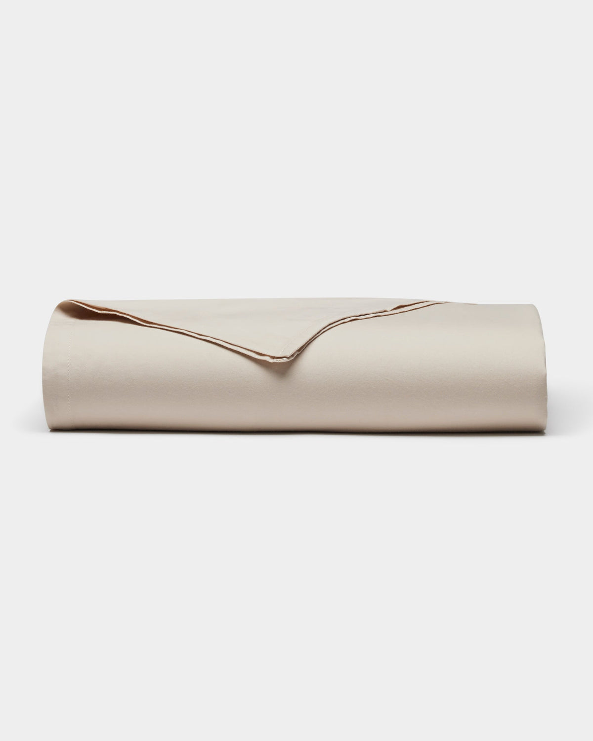The Cozy Earth Soft-Wash Cotton Sheet Set is shown neatly folded in light beige on a plain white background.|Color:Driftwood