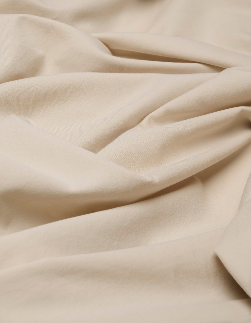 A close-up of the Cozy Earth Soft-Wash Cotton Duvet Bundle in beige, highlighting its smooth texture with soft, delicate folds and gentle creases.|Color:Driftwood