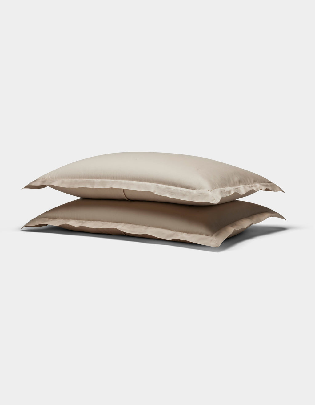 Two Soft-Wash Cotton Quilted Shams by Cozy Earth, in beige, stacked atop each other against a plain white background.|Color:Driftwood