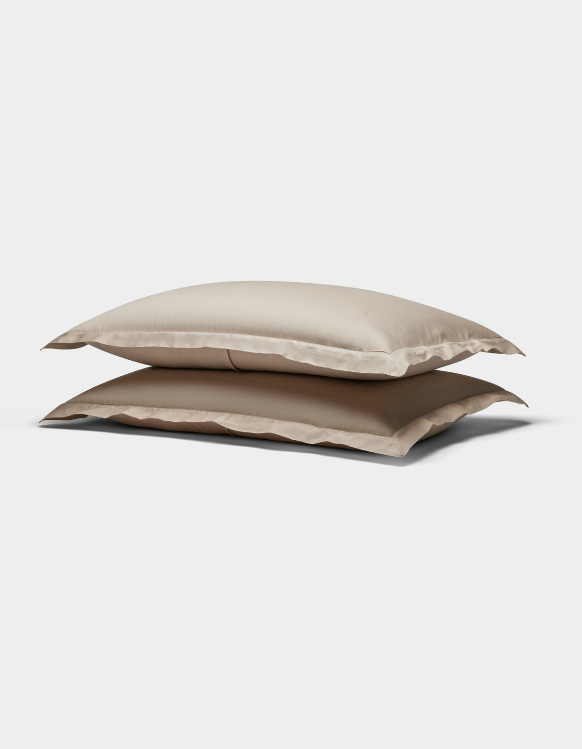 Two Soft-Wash Cotton Quilted Shams by Cozy Earth, in beige, stacked atop each other against a plain white background.|Color:Driftwood