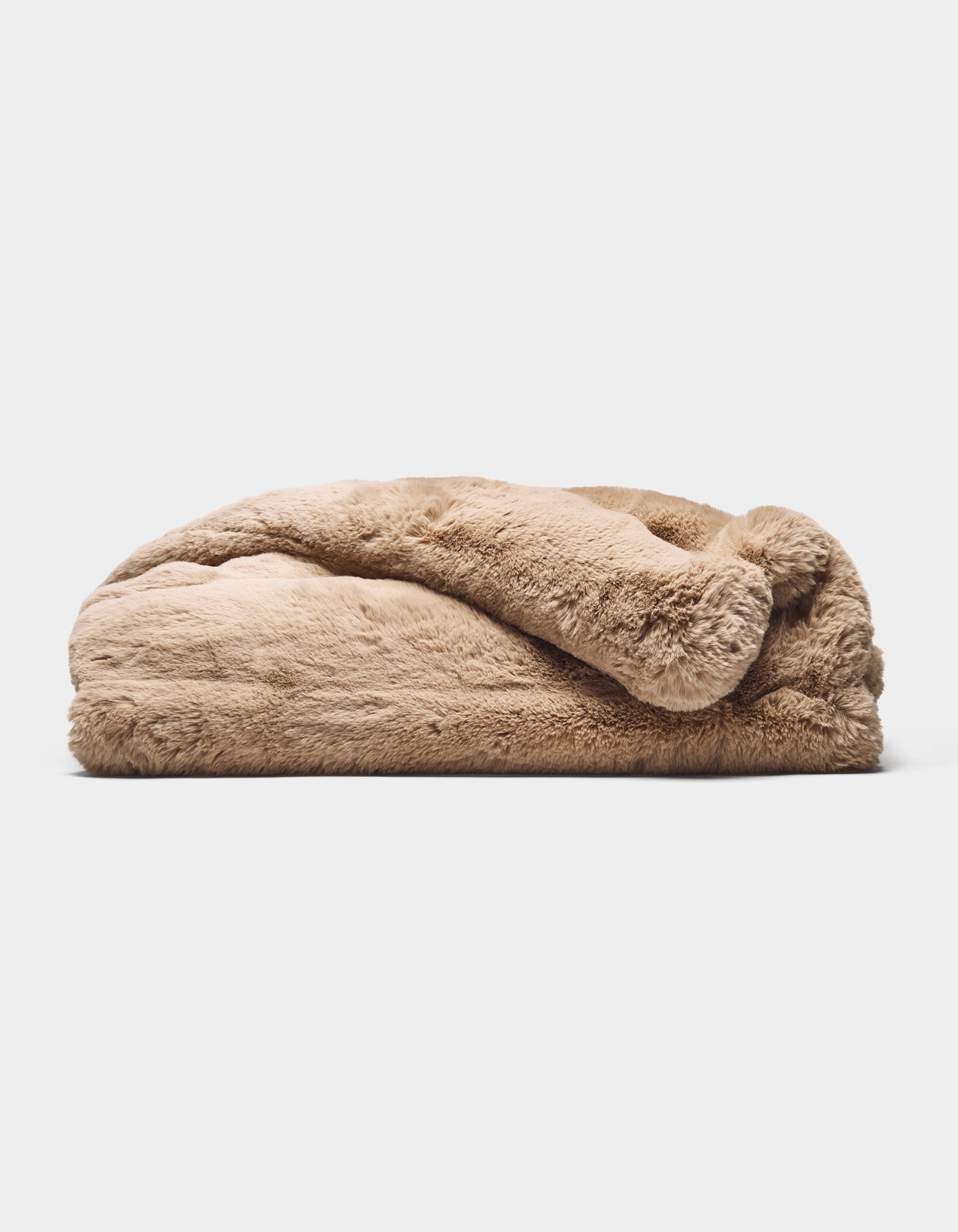 The Cozy Earth Channel Cuddle Blanket, featuring fluffy tan-colored faux fur, is folded and displayed on a flat surface against a plain white background.|Color:Brandy