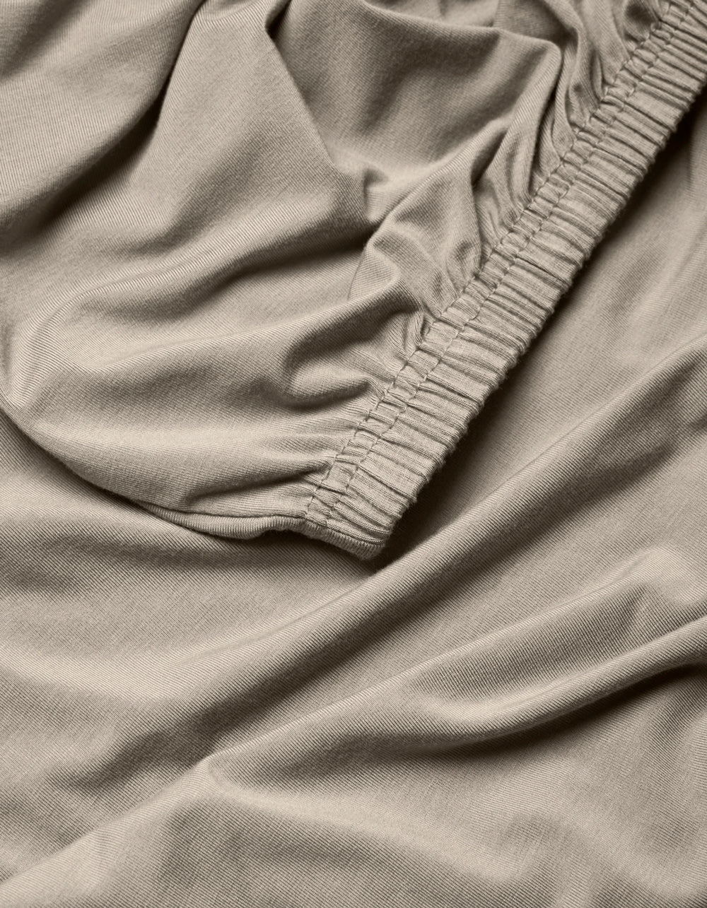 A close-up of the Cozy Earth Bamboo Jersey Fitted Sheet fabric.|Color:Driftwood
