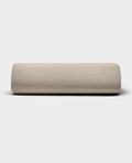The Bamboo Jersey Fitted Sheet by Cozy Earth, shown in light beige with a smooth fabric texture, is displayed against a plain white background.|Color:Driftwood