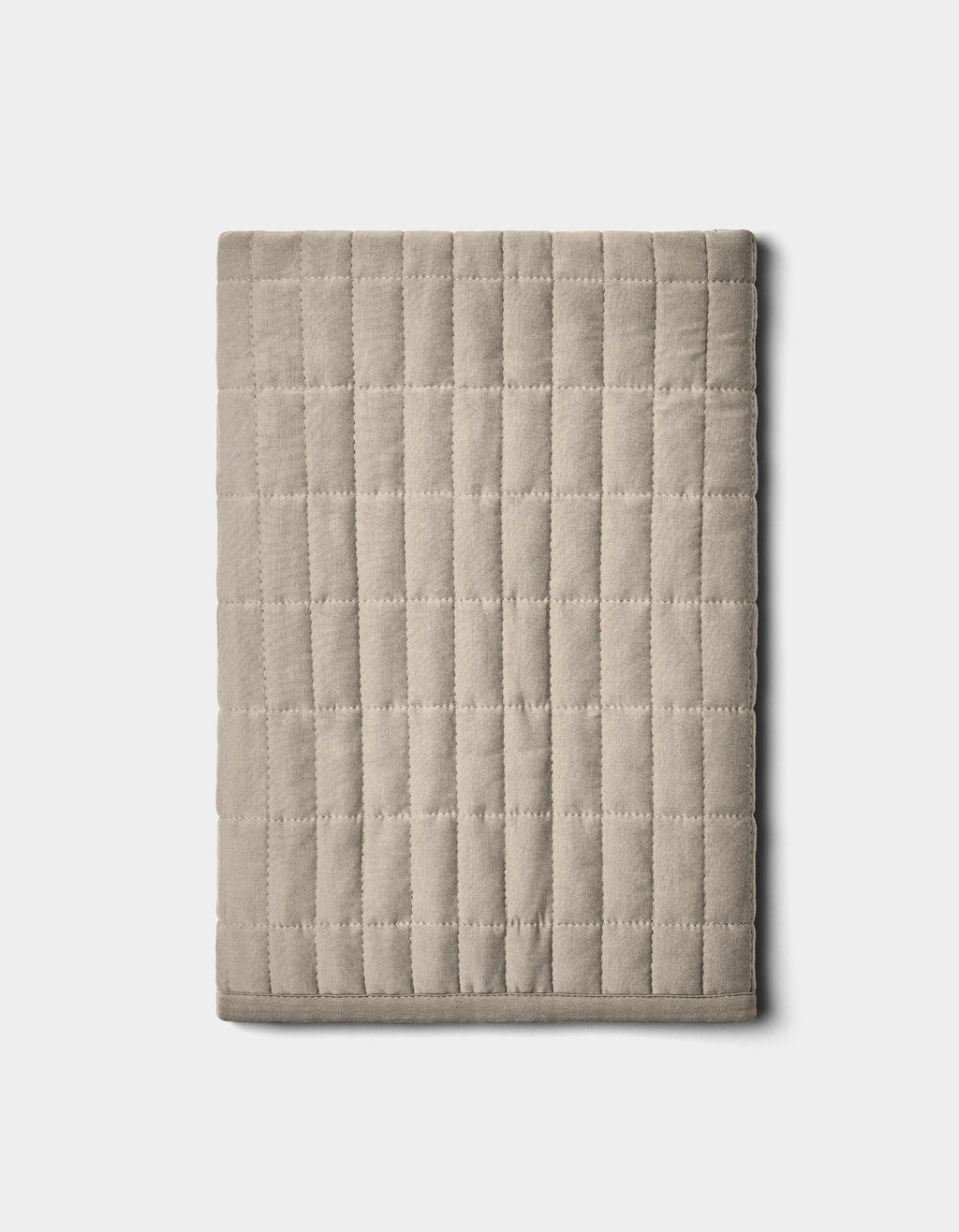 The Bamboo Jersey Quilted Shams by Cozy Earth, shown neatly folded in beige with a grid pattern, are displayed on a plain light background.|Color:Driftwood