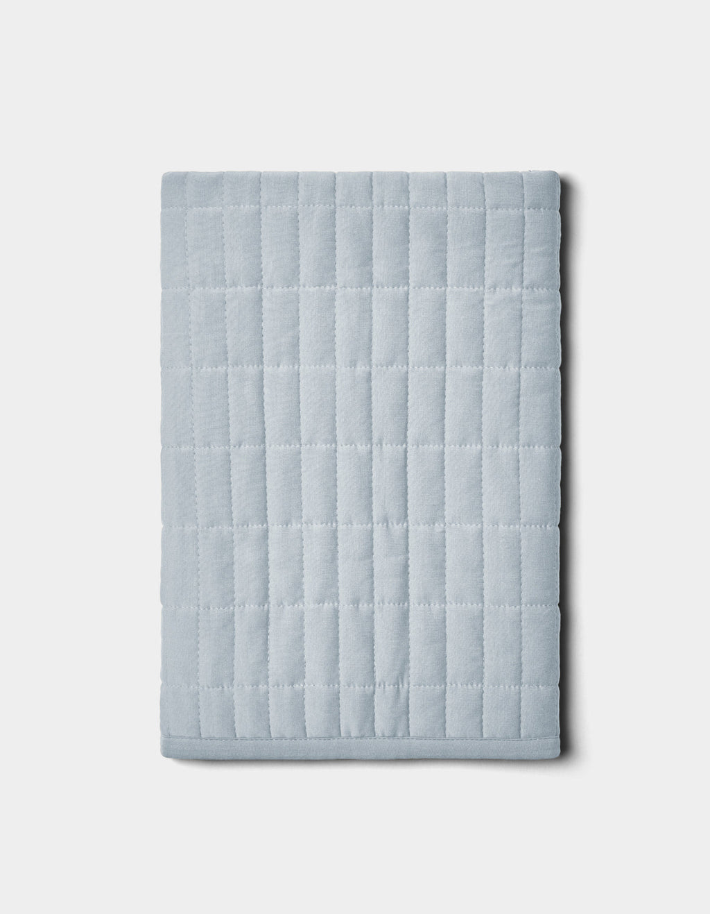 The Cozy Earth Bamboo Jersey Quilted Shams feature a folded, light gray design with a square grid pattern, shown on a plain white background.|Color:Shore