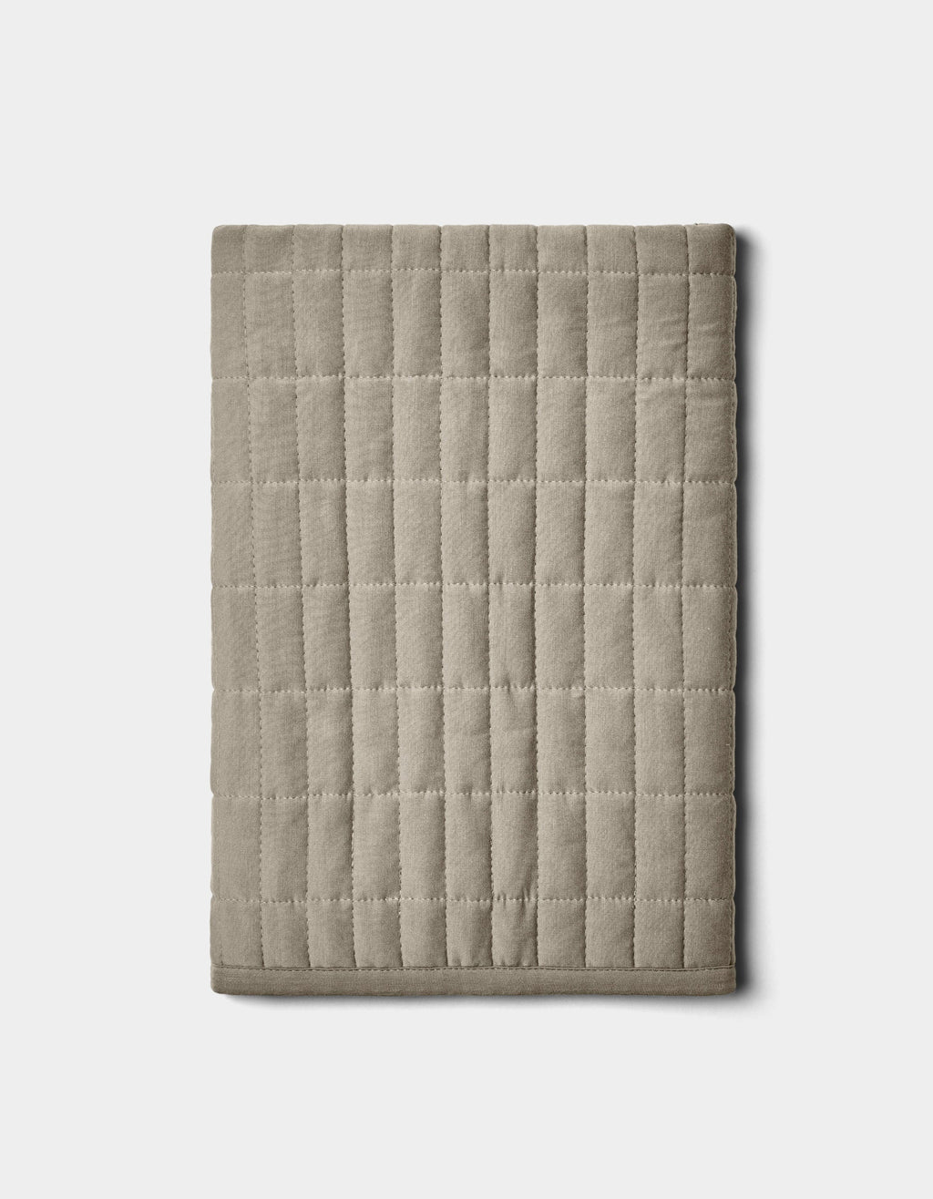 The Cozy Earth Bamboo Jersey Quilted Shams in beige feature a square grid pattern and are displayed folded on a plain white background.|Color:Stone