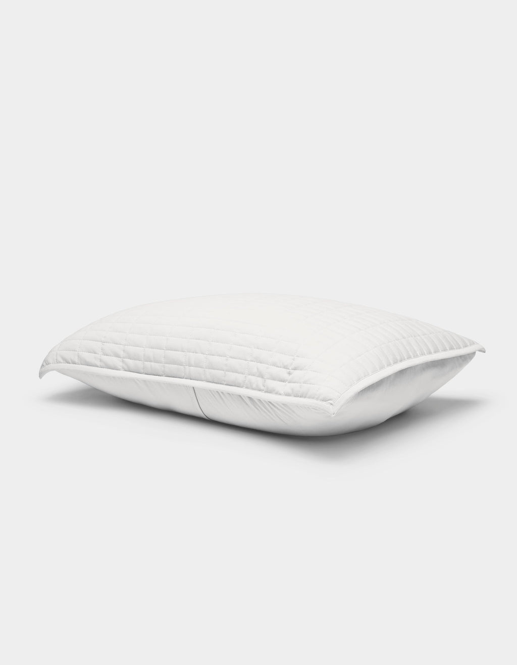 The Cozy Earth Bamboo Jersey Quilted Sham is a white, rectangular pillow cover with a quilted pattern, displayed against a light background. It looks plush with a gentle indentation in the center.|Color:White