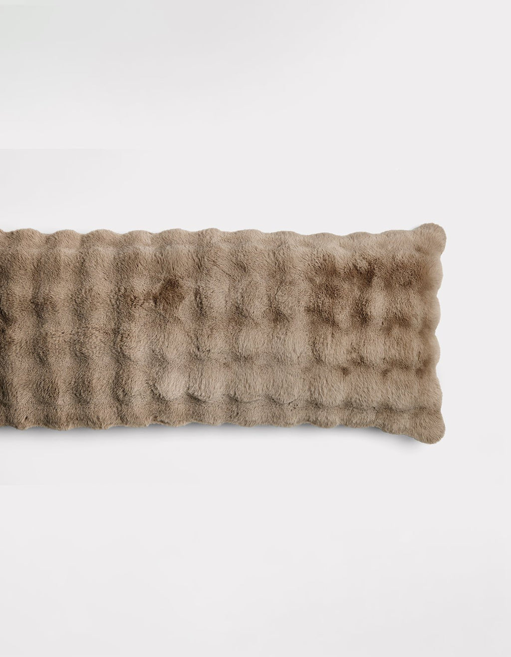 The Bubble Cuddle Pillow by Cozy Earth is a rectangular, light brown pillow with a soft, plush, furry texture, shown against a plain white background.|Color:Walnut |Size:Body - 20" x 54"